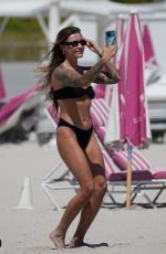 SOPHIA THOMALLA in a Black Bikini at a Beach in Miami 03/21/2023