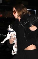 CARA DELEVINGNE with Her Dog Arrives at Her Hotel in New York 04/28/2023