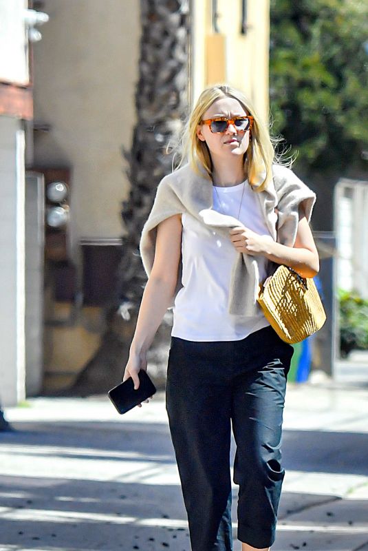 DAKOTA FANNING Leaves a Lunch in Los Angeles 03/31/2023