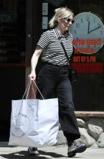 EMMA ROBERTS Gets a Few Clothing Items Altered in Los Angeles 04/07/2023