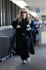 KATHRYN NEWTON Arrives at LAX Airport in Los Angeles 04/03/2023