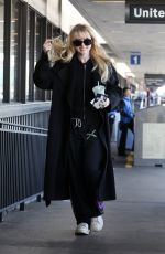 KATHRYN NEWTON Arrives at LAX Airport in Los Angeles 04/03/2023