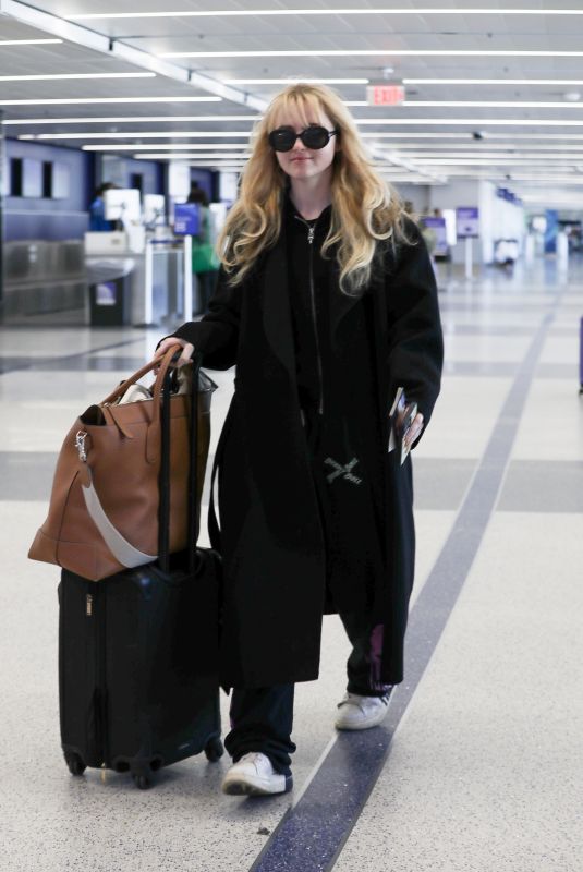 KATHRYN NEWTON Arrives at LAX Airport in Los Angeles 04/03/2023