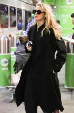KATHRYN NEWTON Arrives at LAX Airport in Los Angeles 04/11/2023