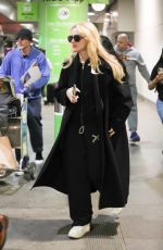 KATHRYN NEWTON Arrives at LAX Airport in Los Angeles 04/11/2023