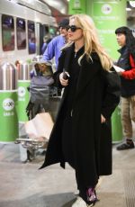 KATHRYN NEWTON Arrives at LAX Airport in Los Angeles 04/11/2023