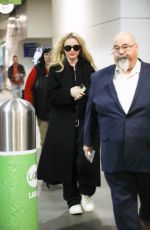 KATHRYN NEWTON Arrives at LAX Airport in Los Angeles 04/11/2023