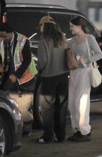 KATIE HOLMES and SURI CRUSIE at LAX Airport in Los Angeles 04/24/2023
