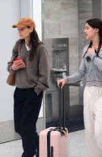 KATIE HOLMES and SURI CRUSIE at LAX Airport in Los Angeles 04/24/2023