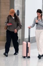 KATIE HOLMES and SURI CRUSIE at LAX Airport in Los Angeles 04/24/2023