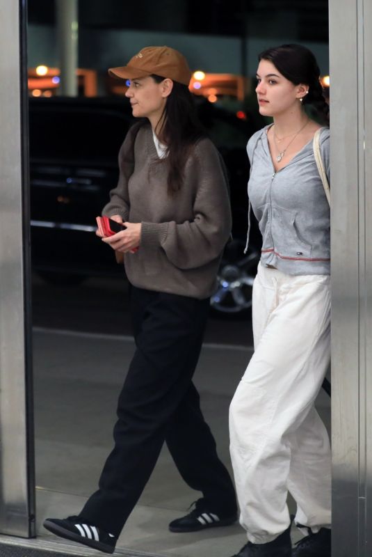 KATIE HOLMES and SURI CRUSIE at LAX Airport in Los Angeles 04/24/2023