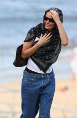 LARA BINGLE in Swimsuit at a Photoshoot at a Beach in Sydney 04/15/2023