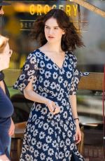 LILY JAMES on the Set of Relay in New York 04/12/2023