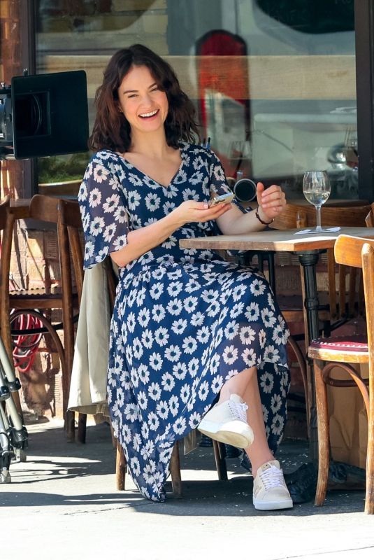 LILY JAMES on the Set of Relay in New York 04/12/2023