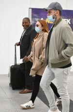 LINDSAY LOHAN and Husband Bader Shammas at JFK Airport in New York 04/18/2023 