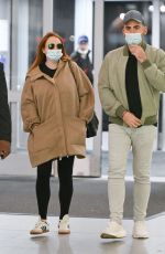 LINDSAY LOHAN and Husband Bader Shammas at JFK Airport in New York 04/18/2023 