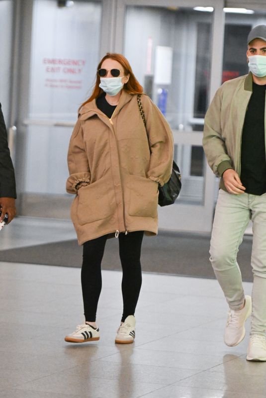 LINDSAY LOHAN and Husband Bader Shammas at JFK Airport in New York 04/18/2023