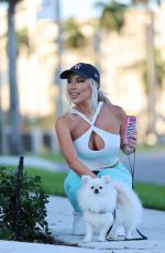LISA OPIE Out with Her Dog in Miami 04/26/2023