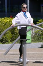 MICHELLE HUNZIKER Working Out at a Park in Milan 04/25/2023