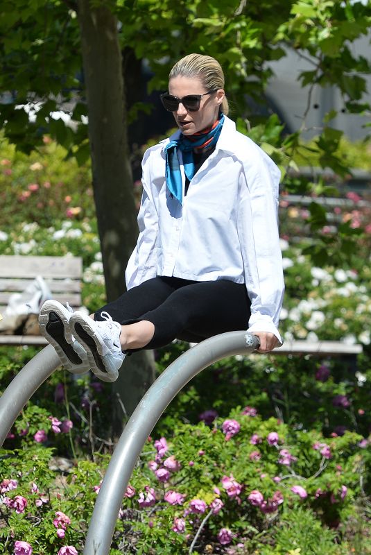 MICHELLE HUNZIKER Working Out at a Park in Milan 04/25/2023