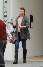 MILLA JOVOVICH Leaves a Skin Care Clinic in Beverly Hills 04/17/2023