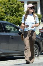 OLIVIA WILDE Out with a Male Friend at All Time Cafe in Los Angeles 04/07/2023