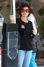 SHARON OSBOURNE Waits for Her Car at Valet in Beverly Hills 04/27/2023