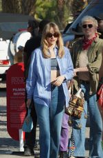 SUKI WTAERHOUSE Arrives at Revolve Party at Coachella 2023 Music Festival in Indio 04/15/2023