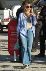 SUKI WTAERHOUSE Arrives at Revolve Party at Coachella 2023 Music Festival in Indio 04/15/2023