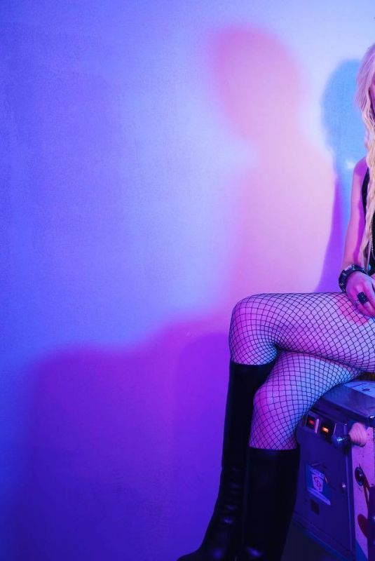TAYLOR MOMSEN at a Photoshoot, April 2023