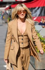 ASHLEY ROBERTS Arrives at Heart Radio in London 05/03/2023