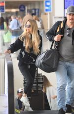 CHRISTINA and Joshua HALL Arrives at LAX Airport in Los Angeles 04/30/2023