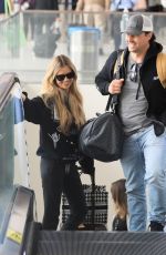 CHRISTINA and Joshua HALL Arrives at LAX Airport in Los Angeles 04/30/2023