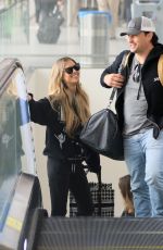 CHRISTINA and Joshua HALL Arrives at LAX Airport in Los Angeles 04/30/2023