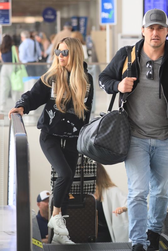 CHRISTINA and Joshua HALL Arrives at LAX Airport in Los Angeles 04/30/2023