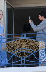 ELLE FANNING at a Photoshoot on Her Hotel Balcony in Cannes 05/16/2023