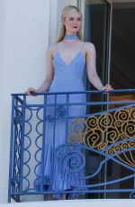 ELLE FANNING at a Photoshoot on Her Hotel Balcony in Cannes 05/16/2023