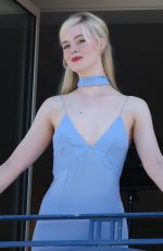 ELLE FANNING at a Photoshoot on Her Hotel Balcony in Cannes 05/16/2023