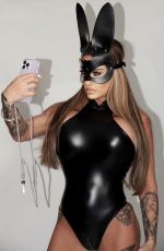KATIE PRICE in a Black Tight PVC Easter Outfit at a Photoshoot 04/11/2023