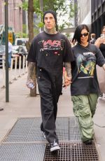 KOURTNEY KARDASHIAN and Travis Barker Out at 5th Avenue in New York 05/19/2023