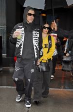 KOURTNEY KARDASHIAN and Travis Barker Out in Rainy New York 05/20/2023