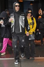 KOURTNEY KARDASHIAN and Travis Barker Out in Rainy New York 05/20/2023