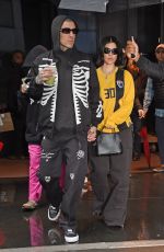 KOURTNEY KARDASHIAN and Travis Barker Out in Rainy New York 05/20/2023