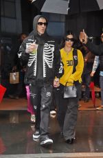 KOURTNEY KARDASHIAN and Travis Barker Out in Rainy New York 05/20/2023