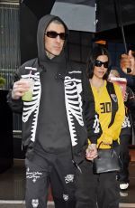 KOURTNEY KARDASHIAN and Travis Barker Out in Rainy New York 05/20/2023