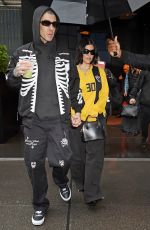KOURTNEY KARDASHIAN and Travis Barker Out in Rainy New York 05/20/2023