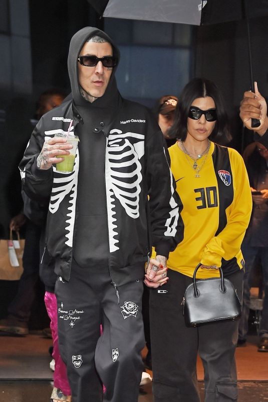 KOURTNEY KARDASHIAN and Travis Barker Out in Rainy New York 05/20/2023