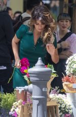 PENELOPE CRUZ on the Set of a Commercial at a Flower Stand in Madrid 05/30/2023