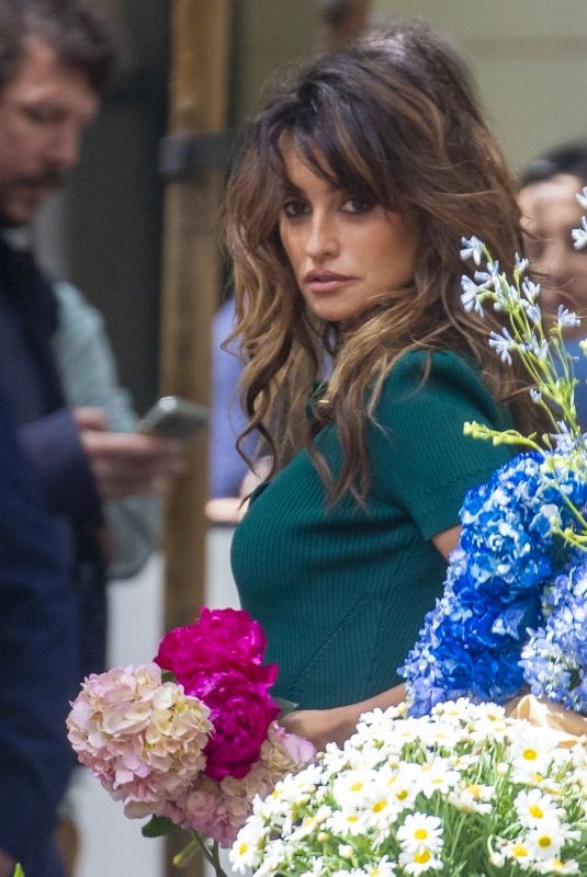 PENELOPE CRUZ on the Set of a Commercial at a Flower Stand in Madrid 05/30/2023