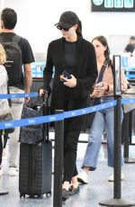 Pregnant KARLIE KLOSS Arrives at Miami International Airport 05/16/2023
